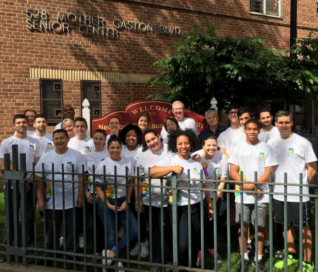assurant team volunteering with habitat for humanity
